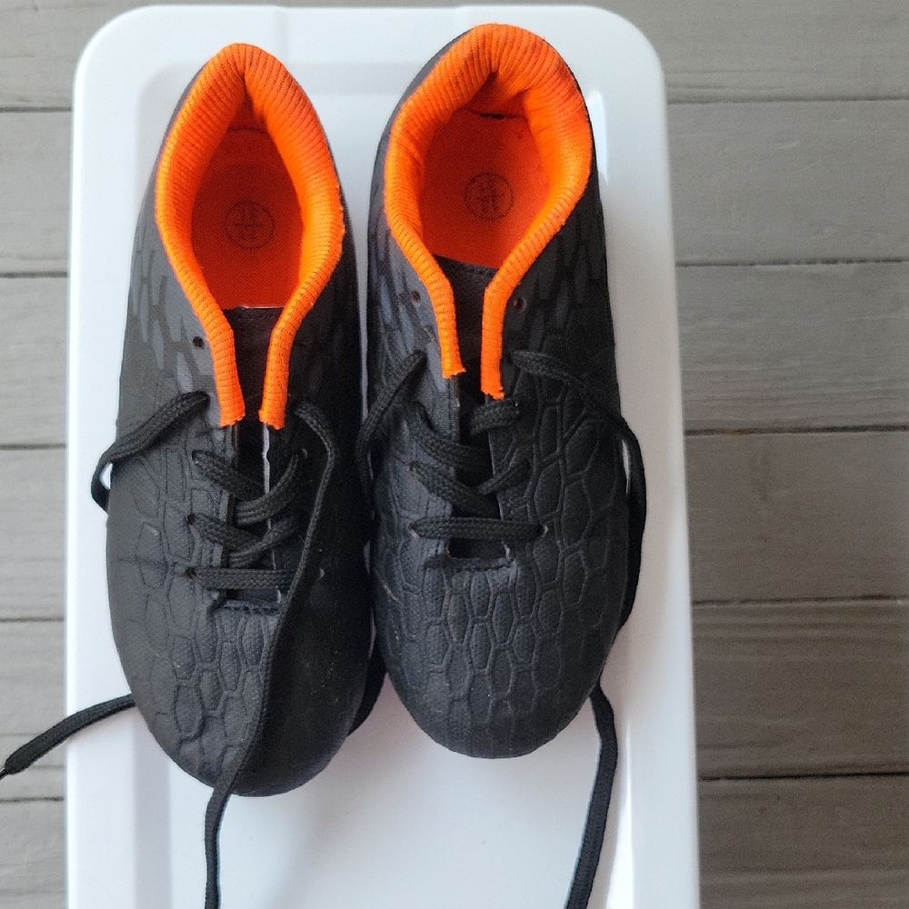 Kids Black and Orange Soccer Cleats